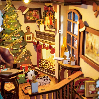 A book nook showing the interior of a house celebrating Christmas: a tree, garlands, and a Dalmatian.