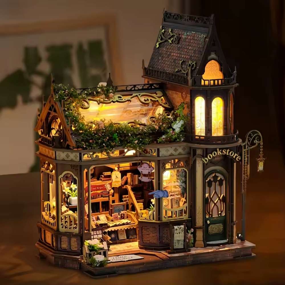 Stained glass window detail on English Botanical Bookstore DIY miniature — purple gold Victorian Gothic facade