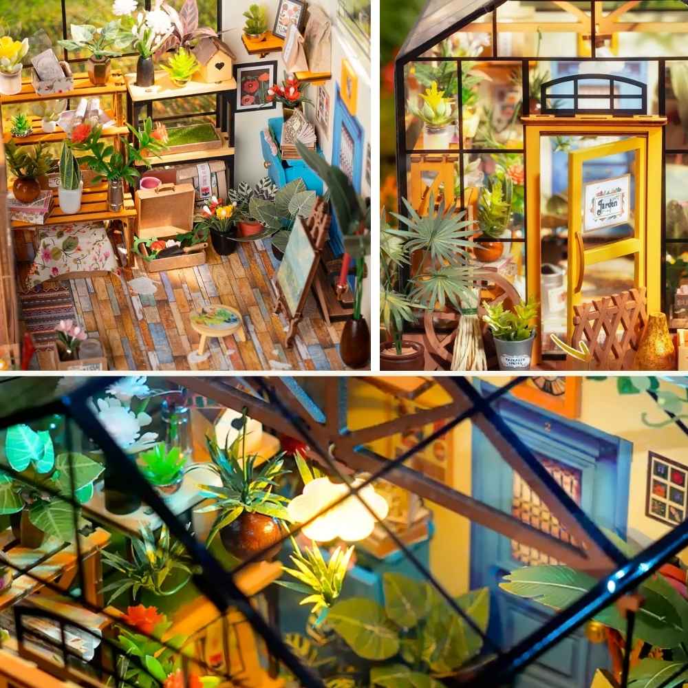 Cathy's Flower House miniature greenhouse LED lit at night — warm light through four transparent glass walls